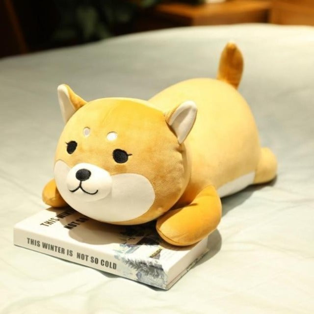 A shiba plush japan that is brown and cute