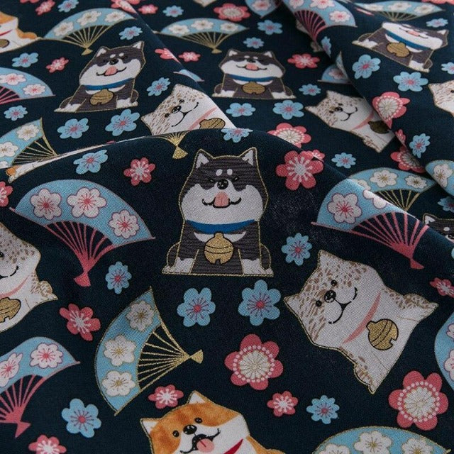 A black shiba on a blue piece of fabric