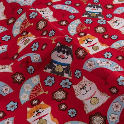 different coloured shibas on red fabric