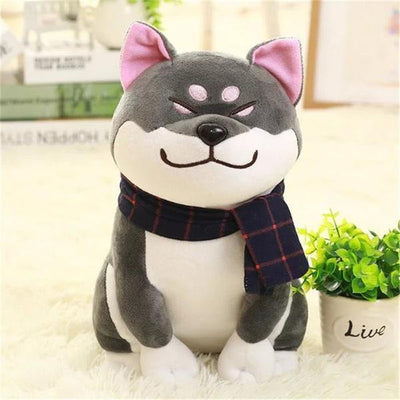 Grey furry japanese shiba plush, with books in the background