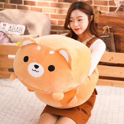 Woman holding a plush japanese shiba pillow