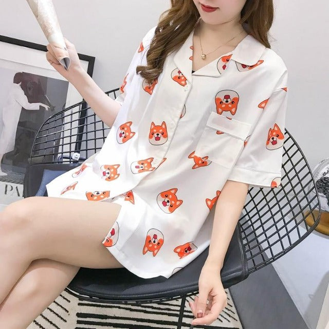 Woman holding magazine in shiba inu designed night shirt