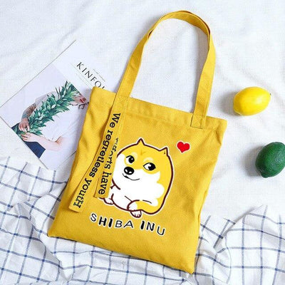 Yellow tote bag and a print of a cheeky shiba inu