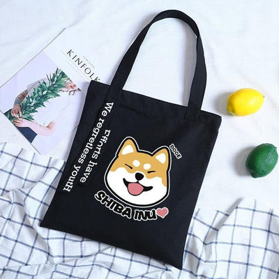 A smiley shiba on a black bag