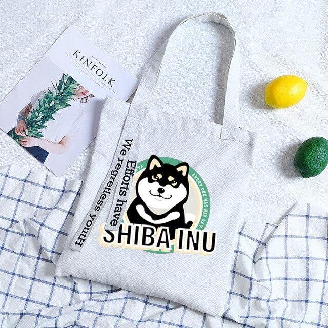 Black shiba inu on a sky blue bag