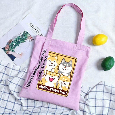 purple tote bag with a design with shibas waving
