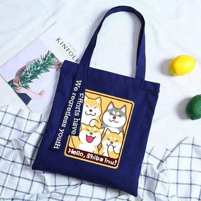 different coloured shibas on a blue tote bag
