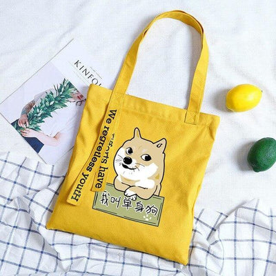 Shiba leaning on a fence printed onto a yellow tote bag