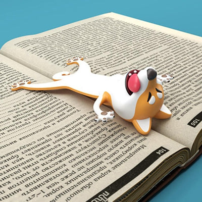 Shiba Inu laying on a book as a bookmark