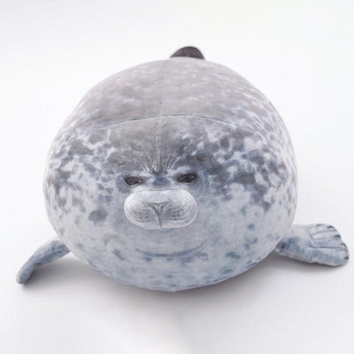 A chonky seal pillow with a white background