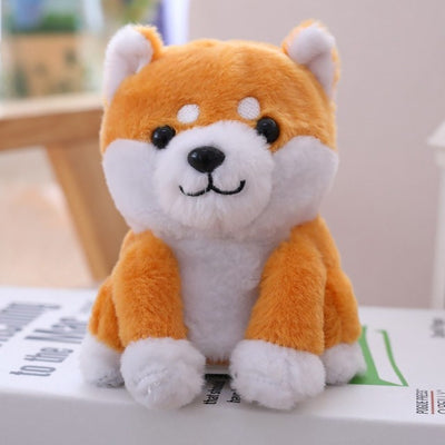 Shiba toy that mimics sitting on a book