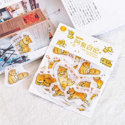 Shiba stickers in a packet and stuck to bits of paper