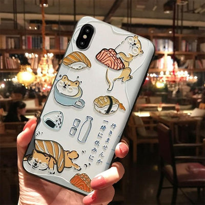Person holding a shiba inu phone case with milk and tea