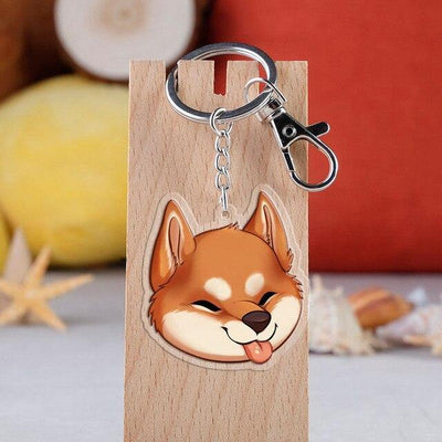 Shiba with tongue sticking out on a key ring attached to a key hook
