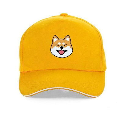 A yellow cap with the face of a shiba inu