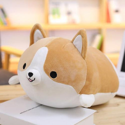 A brown smiling corgi plushie