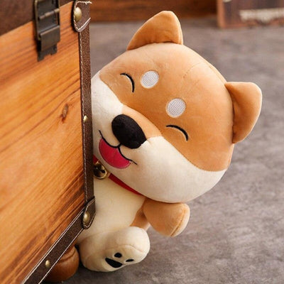 Cartoon faced shiba inu plush toy staring from behind a cupboard