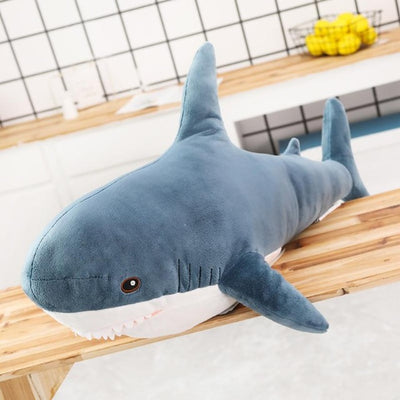 Blue shark plush on a kitchen top