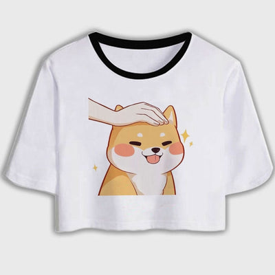 a person patting a cartoon shiba inu design on a crop top