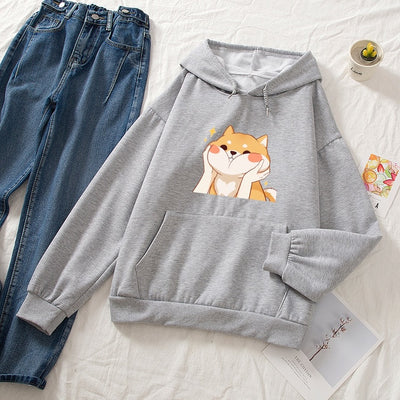 Gray hoodie with a shiba face scrunched up on it