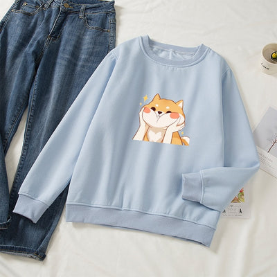 light blue sweatshirt with a shiba blushing design