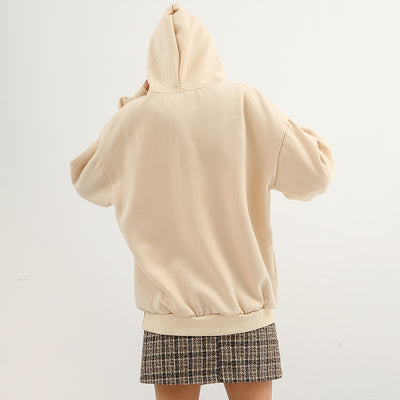 woman wearing hoodie with back turned