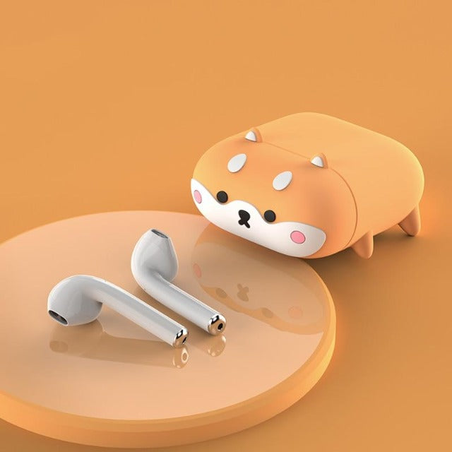 Shiba air pods case next to ear phones