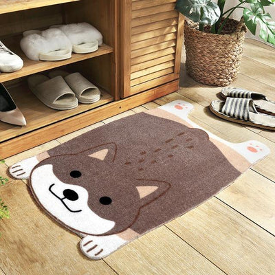 Gray mat in the shape of a shiba on a wooden floor