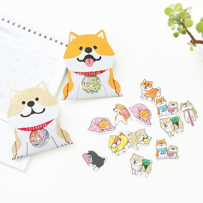 A set of stickers with orange and gray shibas