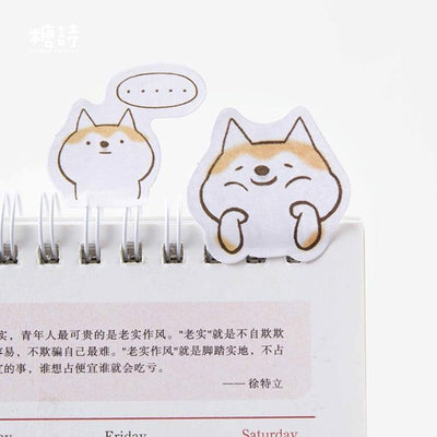 shiba inu stickers facebook are similar to these on a notebook