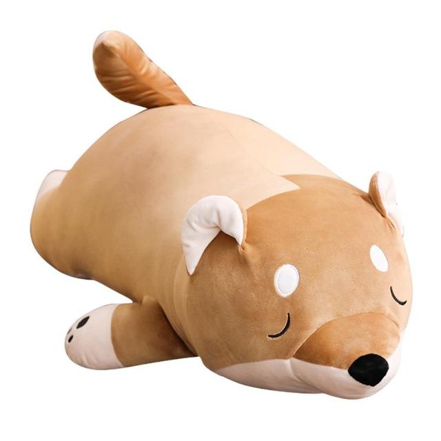 big shiba inu toy laying asleep